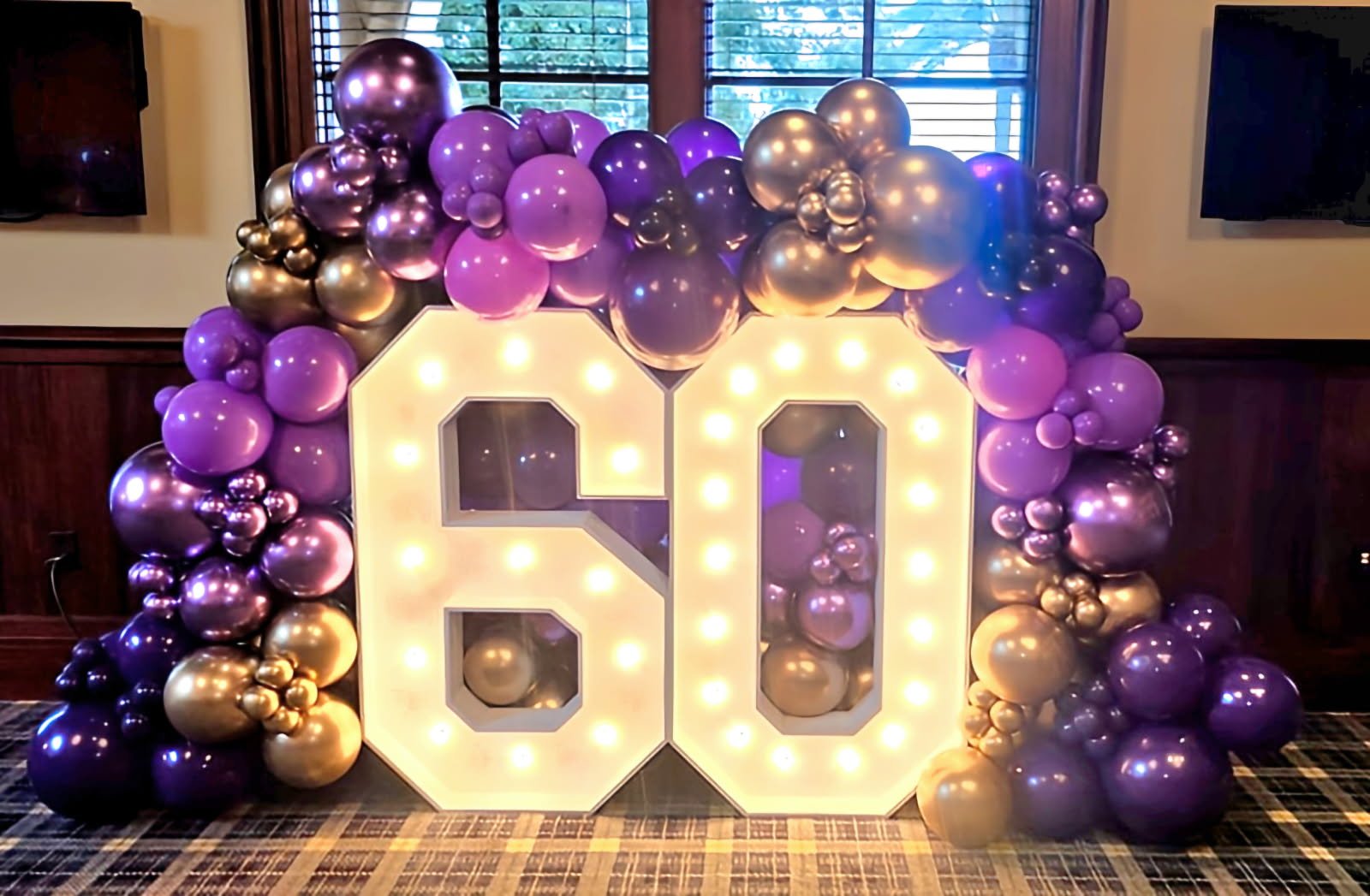 Balloon setup for a 60th birthday celebration